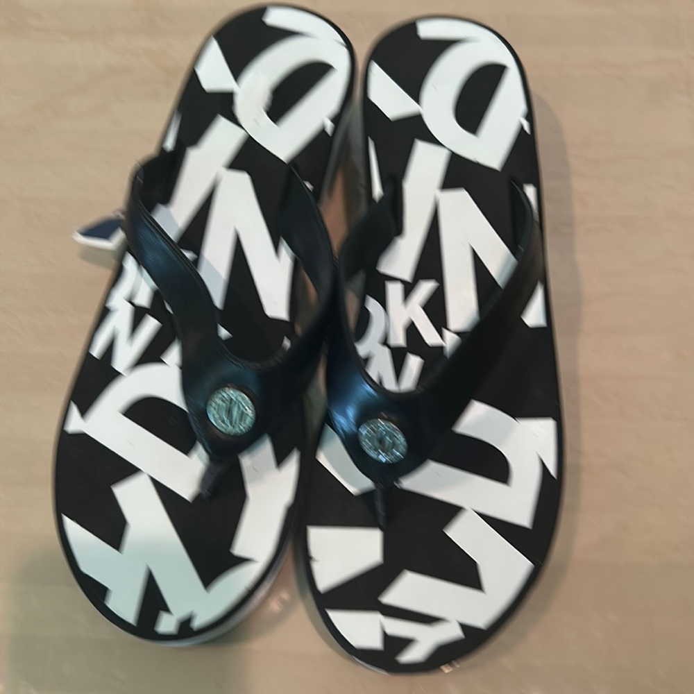 DKNY monogrammed black and white women’s platform flip flops